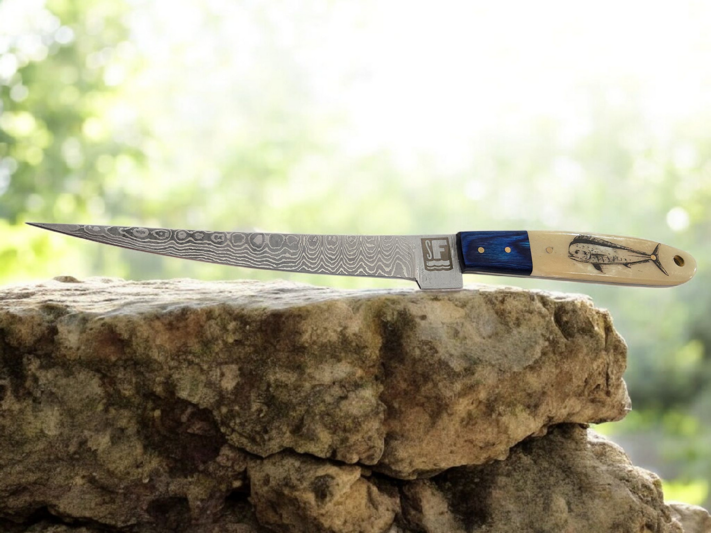 Something's Fishy Branded
14" Stainless steel Damascus Fillet knife twist pattern 256 layers with full tang, etched Mahi Fish on Bone handle with blue wood finish.
